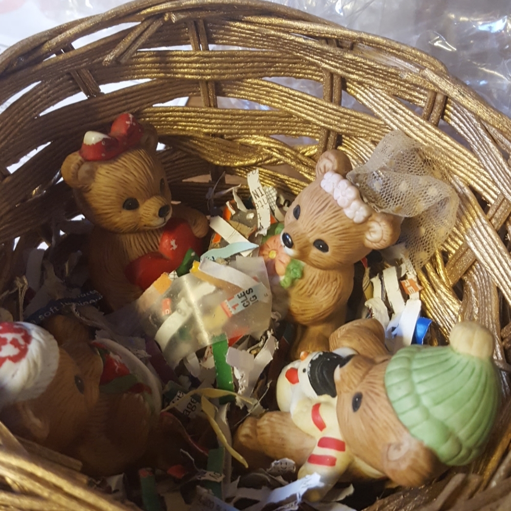 4 ceramic bears in a basket